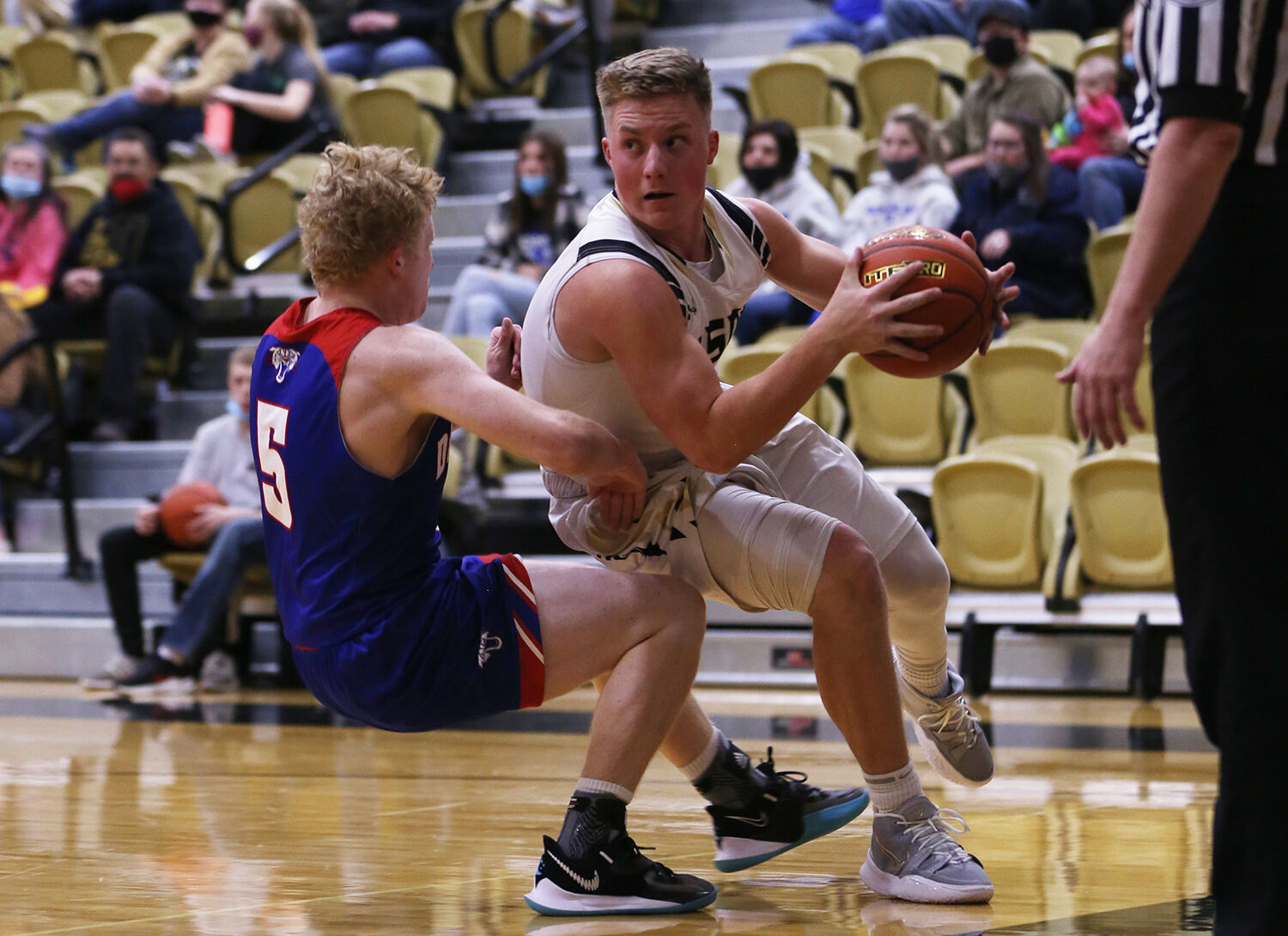 Hyrum Hatch moves under the basket